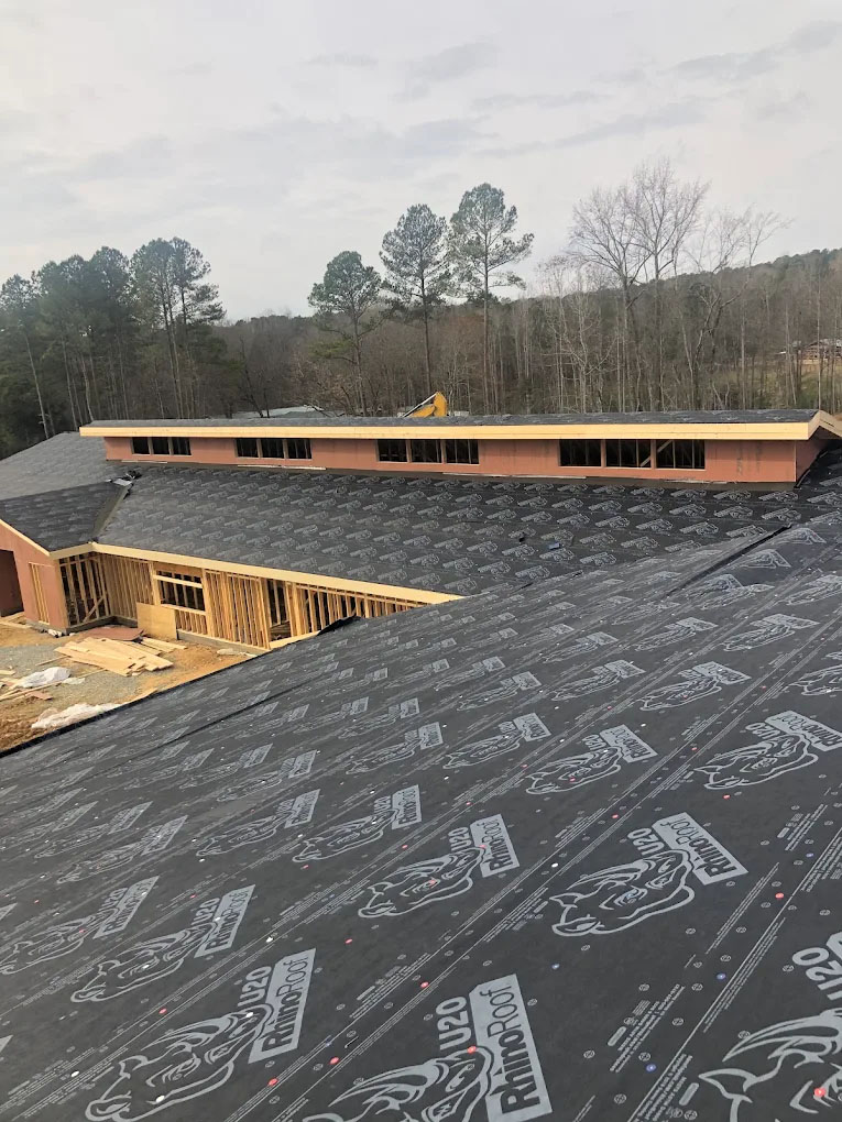 Underlayment laid across a low-slope roof deck